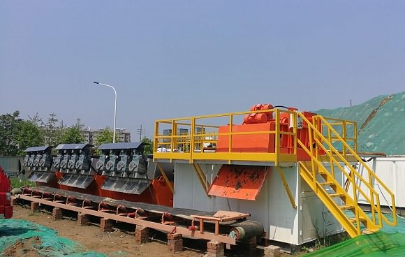 sludge dewatering system and solution